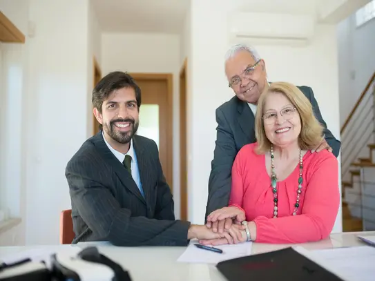Happy business owner with a solar company advisor