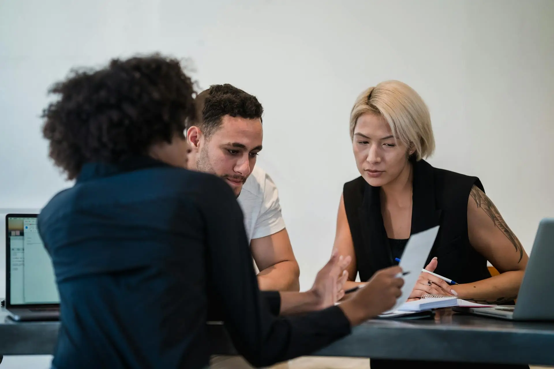 A man with his wife discussing his solar requirements with a solar consultant